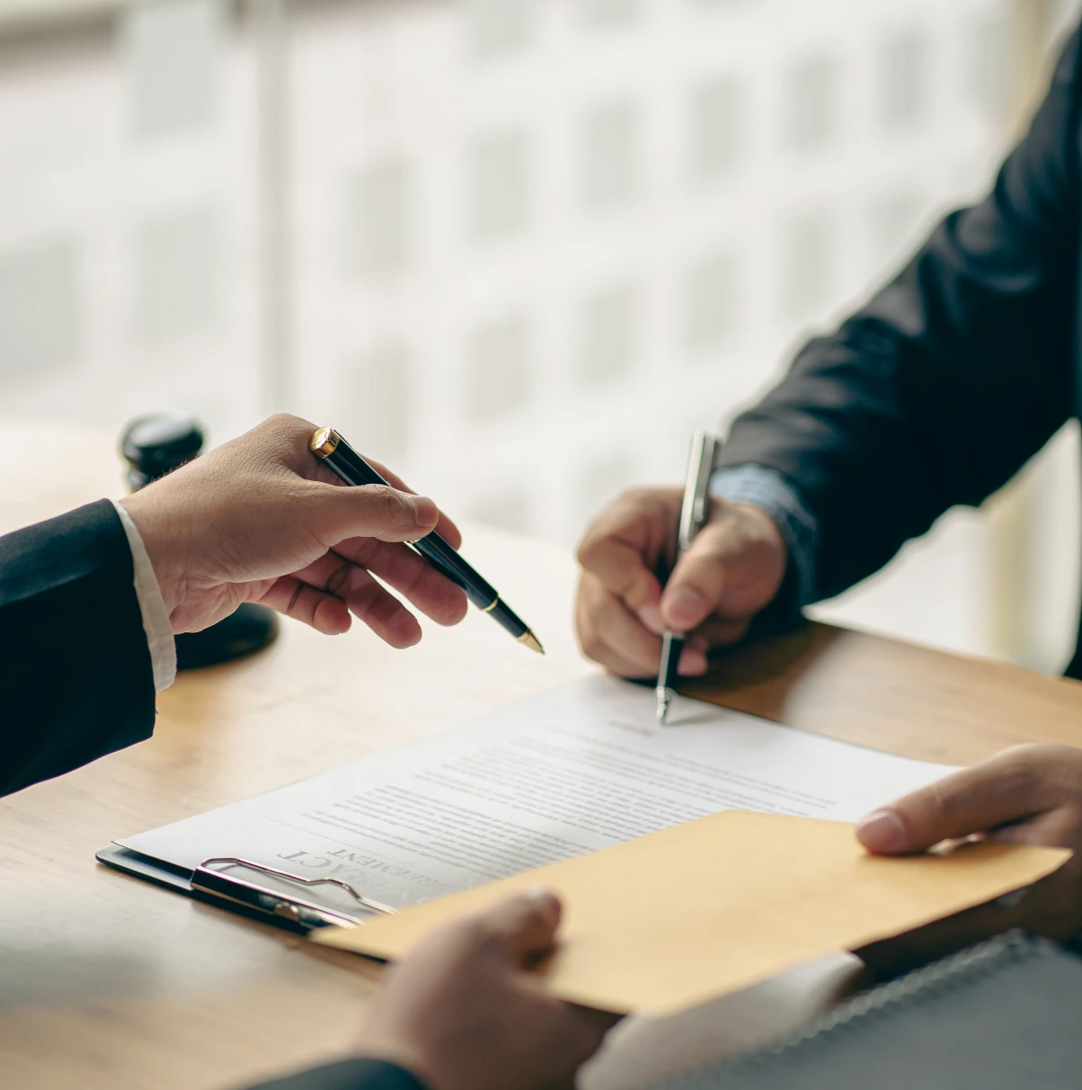 Business contract signing with handshake